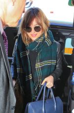 DAKOTA JOHNSON Arrives at Los Angeles International Airport 11/02/2015