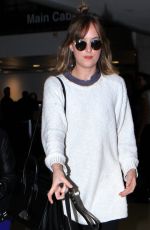 DAKOTA JOHNSON Arrives at Los Angeles International Airport 11/06/2015