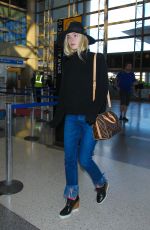 ELLE FANNING Arrives at Los Angeles International Airport 11/04/2015