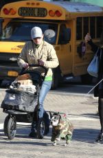 FAMKE JANSSEN Walks Her Dog Out in New York 11/24/2015