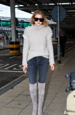 GIGI HADID at Heathrow Airport in London 11/30/2015