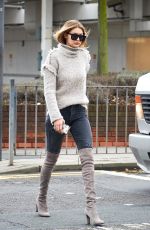 GIGI HADID at Heathrow Airport in London 11/30/2015