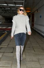 GIGI HADID at Heathrow Airport in London 11/30/2015