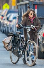 KERI RUSSELL Riding a Bike Out in New York 11/25/2015