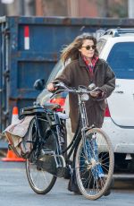 KERI RUSSELL Riding a Bike Out in New York 11/25/2015