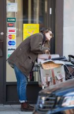 KERI RUSSELL Riding a Bike Out in New York 11/25/2015