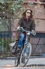 KERI RUSSELL Riding a Bike Out in New York 11/25/2015