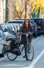 KERI RUSSELL Riding a Bike Out in New York 11/25/2015