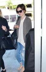 LILY COLLINS Arrives at LAX Airport in Los Angeles 11/08/2015