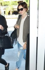 LILY COLLINS Arrives at LAX Airport in Los Angeles 11/08/2015