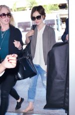 LILY COLLINS Arrives at LAX Airport in Los Angeles 11/08/2015