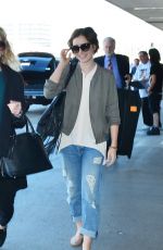 LILY COLLINS Arrives at LAX Airport in Los Angeles 11/08/2015