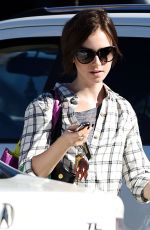 LILY COLLINS Out Shopping in Los Angeles 11/23/2015