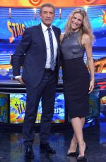 MICHELLE HUNZIKER at Strip The News Photocall in Milan 10/26/2015