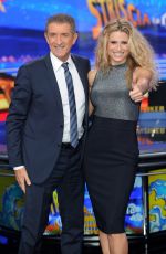 MICHELLE HUNZIKER at Strip The News Photocall in Milan 10/26/2015