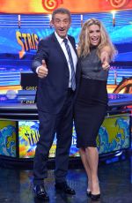 MICHELLE HUNZIKER at Strip The News Photocall in Milan 10/26/2015