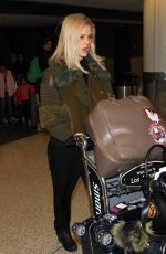 ALICE EVE at Los Angeles International Airport 12/15/2015