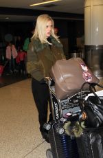 ALICE EVE at Los Angeles International Airport 12/15/2015