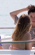 CARA DELEVINGNE on the Beach and Boat in Barbados 12/29/2015