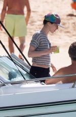CARA DELEVINGNE on the Beach and Boat in Barbados 12/29/2015