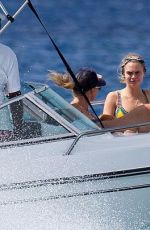 CARA DELEVINGNE on the Beach and Boat in Barbados 12/29/2015