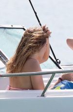 CARA DELEVINGNE on the Beach and Boat in Barbados 12/29/2015