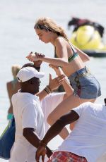 CARA DELEVINGNE on the Beach and Boat in Barbados 12/29/2015