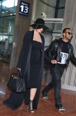 CHRISSY TEIGEN at Charles De Gaulle Airport in Paris 12/27/2015