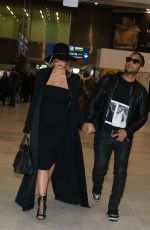 CHRISSY TEIGEN at Charles De Gaulle Airport in Paris 12/27/2015