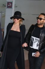 CHRISSY TEIGEN at Charles De Gaulle Airport in Paris 12/27/2015