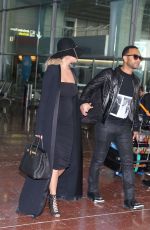 CHRISSY TEIGEN at Charles De Gaulle Airport in Paris 12/27/2015