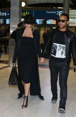 CHRISSY TEIGEN at Charles De Gaulle Airport in Paris 12/27/2015