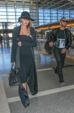 CHRISSY TEIGEN at Los Angeles International Airport 12/25/2015