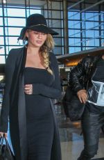 CHRISSY TEIGEN at Los Angeles International Airport 12/25/2015