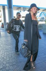 CHRISSY TEIGEN at Los Angeles International Airport 12/25/2015