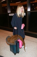 DAKOTA FANNING at Los Angeles International Airport 12/30/2015