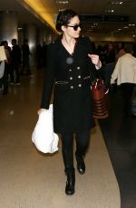 EMMY ROSSUM Arrives at Los Angeles International Airport 12/19/2015