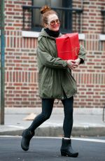 JULIANNE MOORE Carrying a Christmas Present in New York 12/17/2015