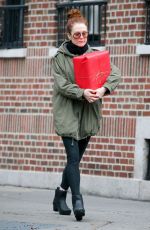 JULIANNE MOORE Carrying a Christmas Present in New York 12/17/2015