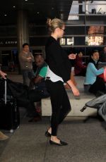 KATE UPTON Arrives at Los Angeles International Airport 12/11/2015