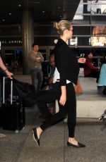 KATE UPTON Arrives at Los Angeles International Airport 12/11/2015