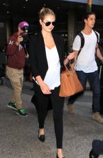 KATE UPTON Arrives at Los Angeles International Airport 12/11/2015