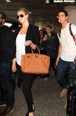 KATE UPTON Arrives at Los Angeles International Airport 12/11/2015