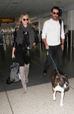 KATE UPTON at LAX Airport in Los Angeles 12/23/2015