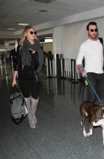 KATE UPTON at LAX Airport in Los Angeles 12/23/2015