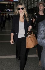 KATE UPTON at Los Angeles International Airport 12/08/15