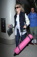 KIM BASINGER Arrives at LAX Airport in Los Angeles 12/21/2015