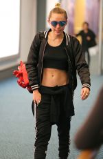 MILEY CYRUS at Vancouver International Airport 12/14/2015