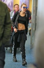 MILEY CYRUS at Vancouver International Airport 12/14/2015