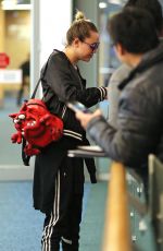 MILEY CYRUS at Vancouver International Airport 12/14/2015